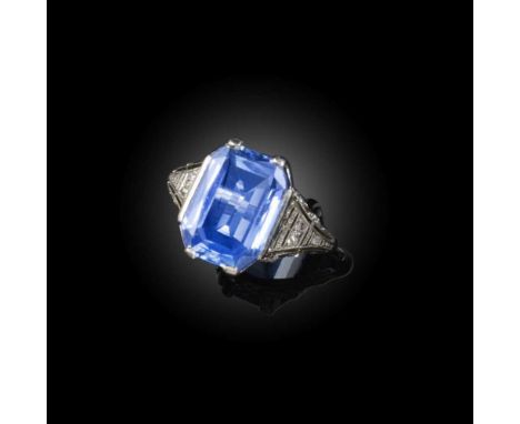 A sapphire and diamond ring, early 20th century, claw-set with a step-cut sapphire weighing approximately 4.00 carats, to an 