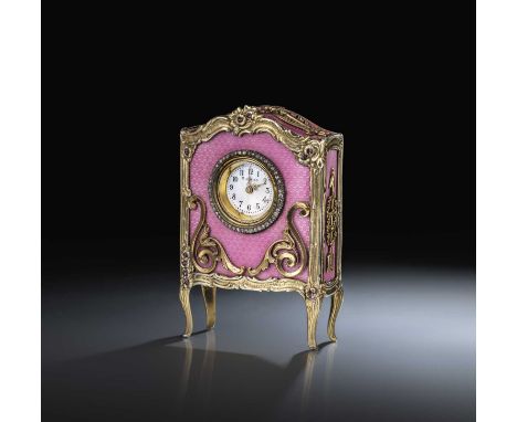 Boucheron, a rare enamel, ruby and diamond desk timepiece, early 20th century, the circular white enamel dial inscribed '8 Jo