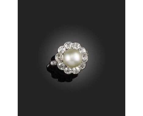 An natural pearl and diamond cluster ring, early 20th century, the pearl set within a surround of old circular-cut diamonds i