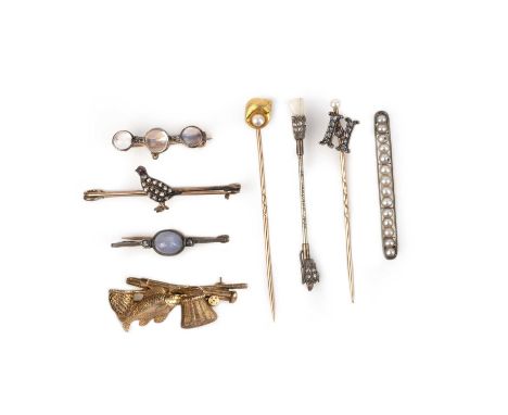 A collection of stick pins and brooches, 19th and early 20th century, comprising: two gold stick pins, one capped with a gold