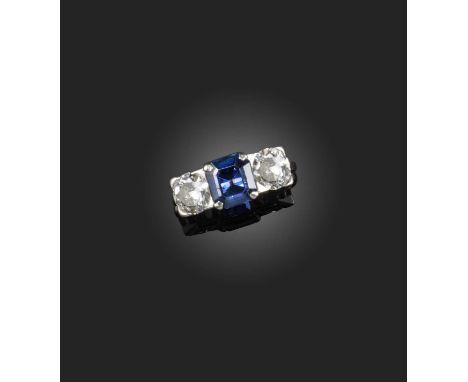 Garrard & Co., a sapphire and diamond ring, circa 1990, set with a step-cut sapphire weighing approximately 2.20 carats, betw