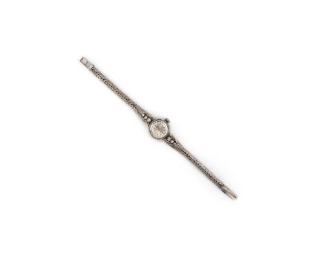 Bucherer, a lady's white gold and diamond wristwatch, the circular brushed metal dial with baton indicators, beneath a facete