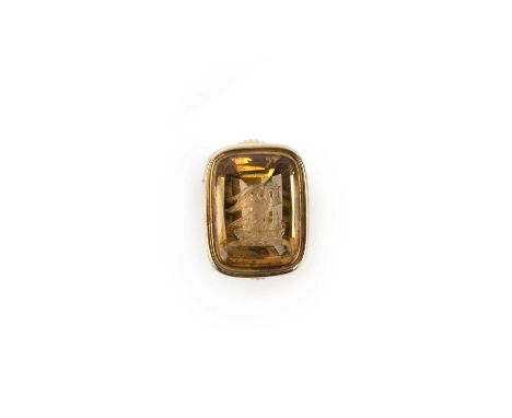 A gold and citrine fob seal, 19th century, set with a step-cut citrine intaglio depicting the Pelican in Her Piety, to a flut