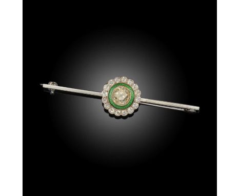 An early 20th century diamond target brooch, the old cushion-shaped diamond within a border of green enamel and a further bor
