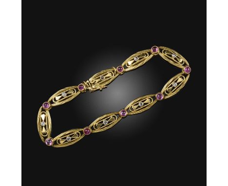 A gold, ruby and diamond bracelet, France, early 20th century, composed of tapering gold links centring on rose-cut diamonds 
