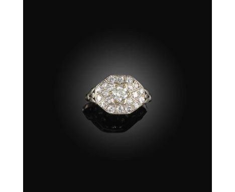 A diamond ring, of cluster design, the octagonal front pavé-set with circular- and single-cut diamonds, mounted in white gold