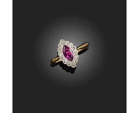 A ruby and diamond ring, of cluster design, set with a marquise-shaped ruby weighing approximately 0.60 carats, within a bord