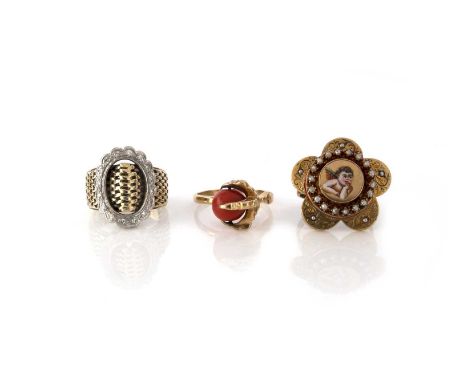 λ A group of three rings, comprising: a ring of buckle design, composed of a textured gold band with an oval band of brillian