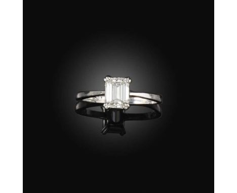 A diamond solitaire ring, set with a step-cut diamond weighing 0.56 carats, to a plain 18ct white gold mount, size L1/2, Brit