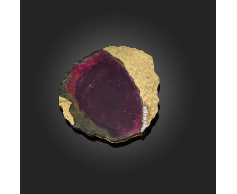 Φ Andrew Grima, a superb tourmaline and diamond brooch/pendant, circa 1971, of abstract design set with a large cross-section