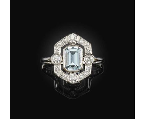 An aquamarine and diamond ring, of geometric design, set with a step-cut aquamarine weighing approximately 0.60 carats, withi