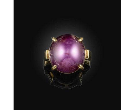 A star ruby ring, claw-set with a cabochon star ruby measuring 14.8 x 13.9 x 10.7mm, mounted in gold, size K1/2, stamped 14K 