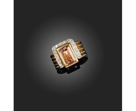 A topaz and diamond ring, collet-set with a step-cut topaz, within a part border of brilliant-cut diamonds, to a fluted gold 