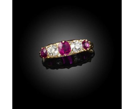 A ruby and diamond ring, early 20th century, of five-stone design, set with three oval rubies spaced by a pair of circular-cu