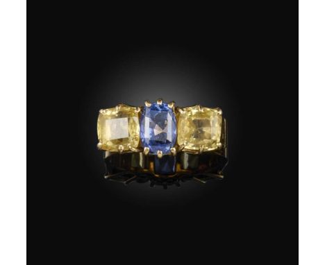 A sapphire ring, set with three cushion-shaped blue and yellow sapphires totalling approximately 4.50 carats, mounted in gold