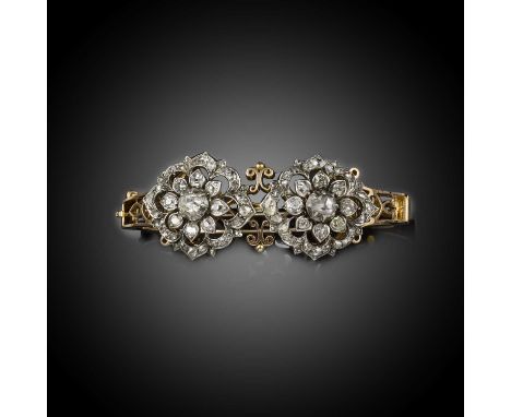 An unusual convertible diamond bangle/pair of brooches, late 19th century, the hinged gold bangle of knife wire construction,