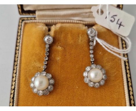 A ATTRACTIVE PAIR OF PEARL AND DIAMOND EAR PENDANTS WITH SCREW BACK FITTINGS WITH LARGE CENTRAL PEARL