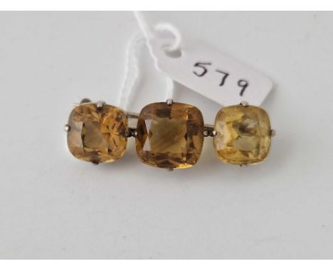 A silver three stone citrine set bar brooch