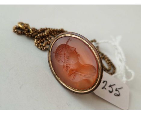 A Victorian carnelian seal with classic male intaglio on 17 inch chain  