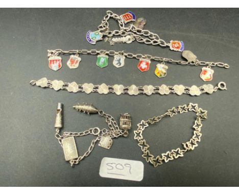 A silver bracelets including charms and enamel fobs 36 gms