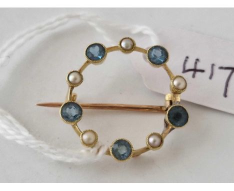 A antique circular aquamarine and pearl set brooch 15ct gold