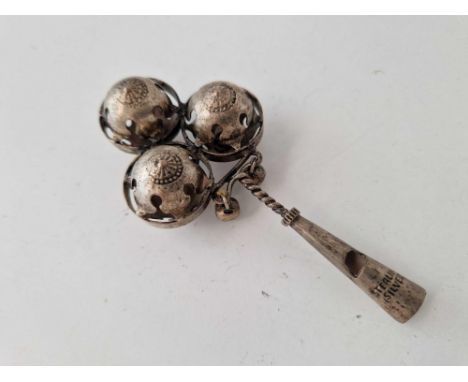 A sterling silver whistle and rattle, stamped STERLING, 4 inches long