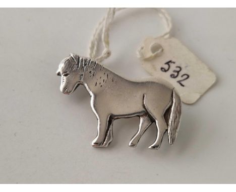 A solid silver pony brooch