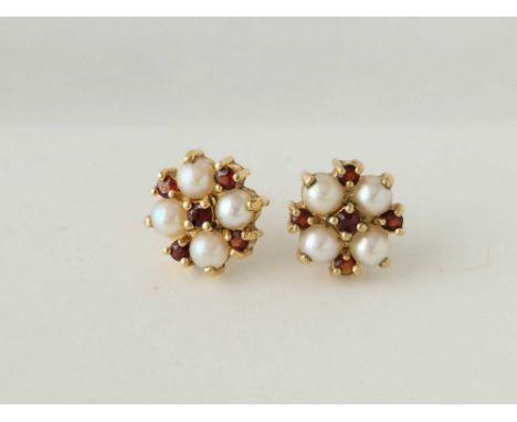 A pair of pearl and garnet ear studs 9ct 2.5 gms