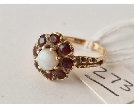 A opal and garnet ring 9ct size P 3 gms