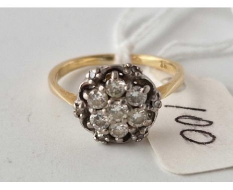 A diamond cluster ring 18ct gold size M 3.5 gms