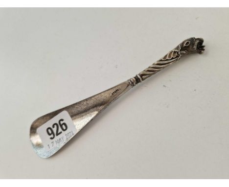 A shoe horn with panther head finial