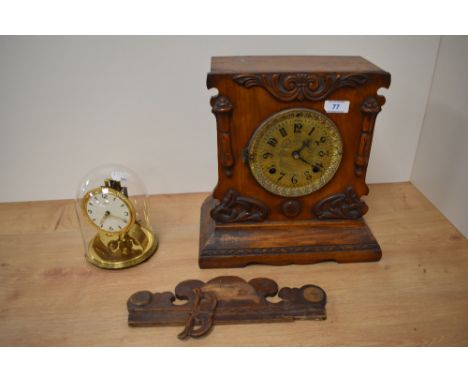 A late Victorian oak cased mantle clock, two train movement, having a brass dial with arabic numerals, the rear door with lab