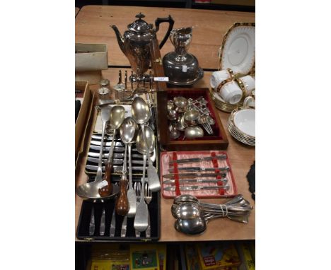 A variety of vintage flat ware, comprising; cased sets of knives including silver plated, ladle, serving spoons, cruet, toast