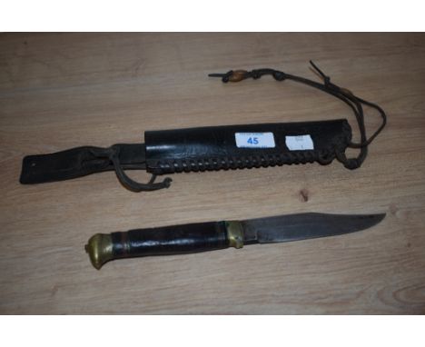 A Bowie Knife with leather grip and scabbard, the blade inscribed 'Original Bowie Knife'