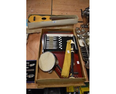 A mid century ukulele in box, a recorder, a small tambourine and a vintage auto harp.