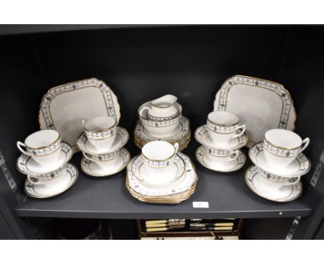 A Melba china tea set, decorated with a Neo-classical design and heightened with gilding