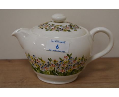 A 20th Century Copeland Spode bullet form tea pot, hand painted with floral patterns, and measuring 13cm tall