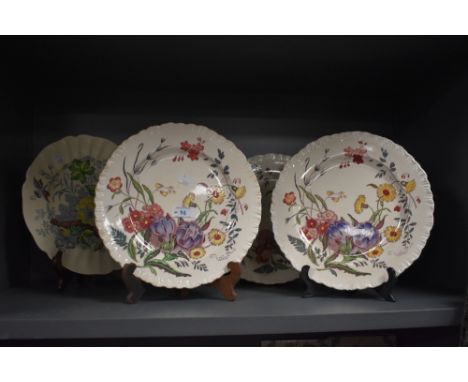 A group of three Wedgwood transfer printed plates, of botanical designs, decorated with Ranunculus flowers, and a Royal Doult