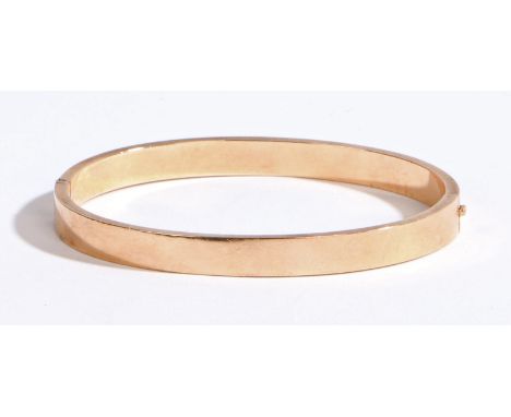 A 15 carat gold bracelet, of plain form with push button mechanism, 60.4mm wide, 8.4g