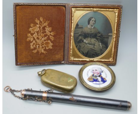 A Victorian leather cased daguerrotype, a cased thermometer, a double sovereign case and a framed porcelain painted plaque of