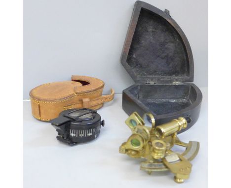 A WWII TG Co. Mk II compass in a leather case and a boxed reproduction sextant 