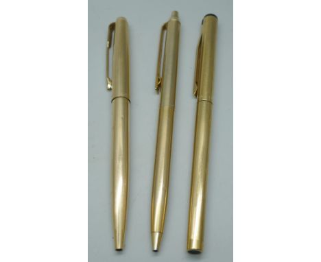 Three gold plated pens, a Sheaffer fountain pen, a Parker ballpoint and a Paper Mate ballpoint