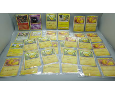 64 Pokémon cards including vintage and various Pikachu 