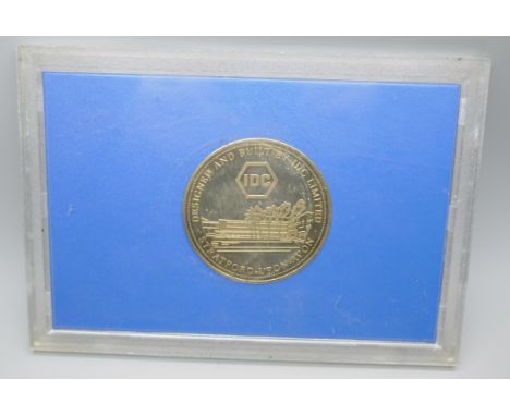 A commemorative large silver plated brass coin for Audi and VW employees for the opening of the VW Headquarters in Milton Key