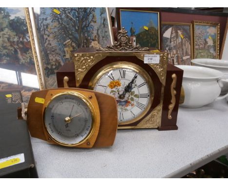 decorative clock and a barometer