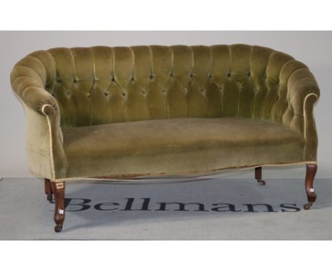 An Edwardian mahogany framed two seat sofaWith green button back upholstery on cabriole supports 155cm wide; 75cm high