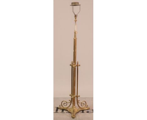 A late Victorian brass height adjustable standard lamp151cm high