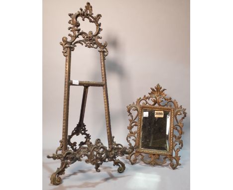 A Victorian style gilt metal miniature easel (2)25cm wide; 54cm high and a similar small table mirror 22cm wide; 30cm high