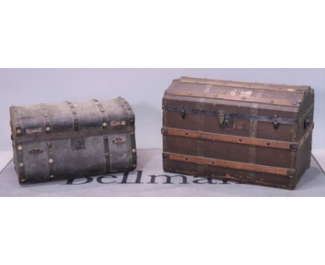 An early 20th domed trunk (3)Another leather and strap iron bound trunk 71cm wide; 45cm high and a early 20th century stained