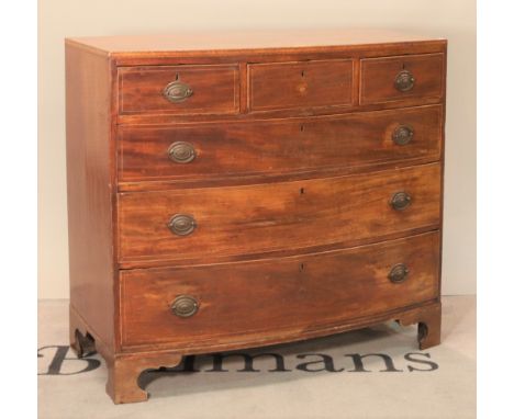 A George III mahogany bowfront chestThree short drawers over three long graduated drawers on bracket feet 111cm wide; 101cm h